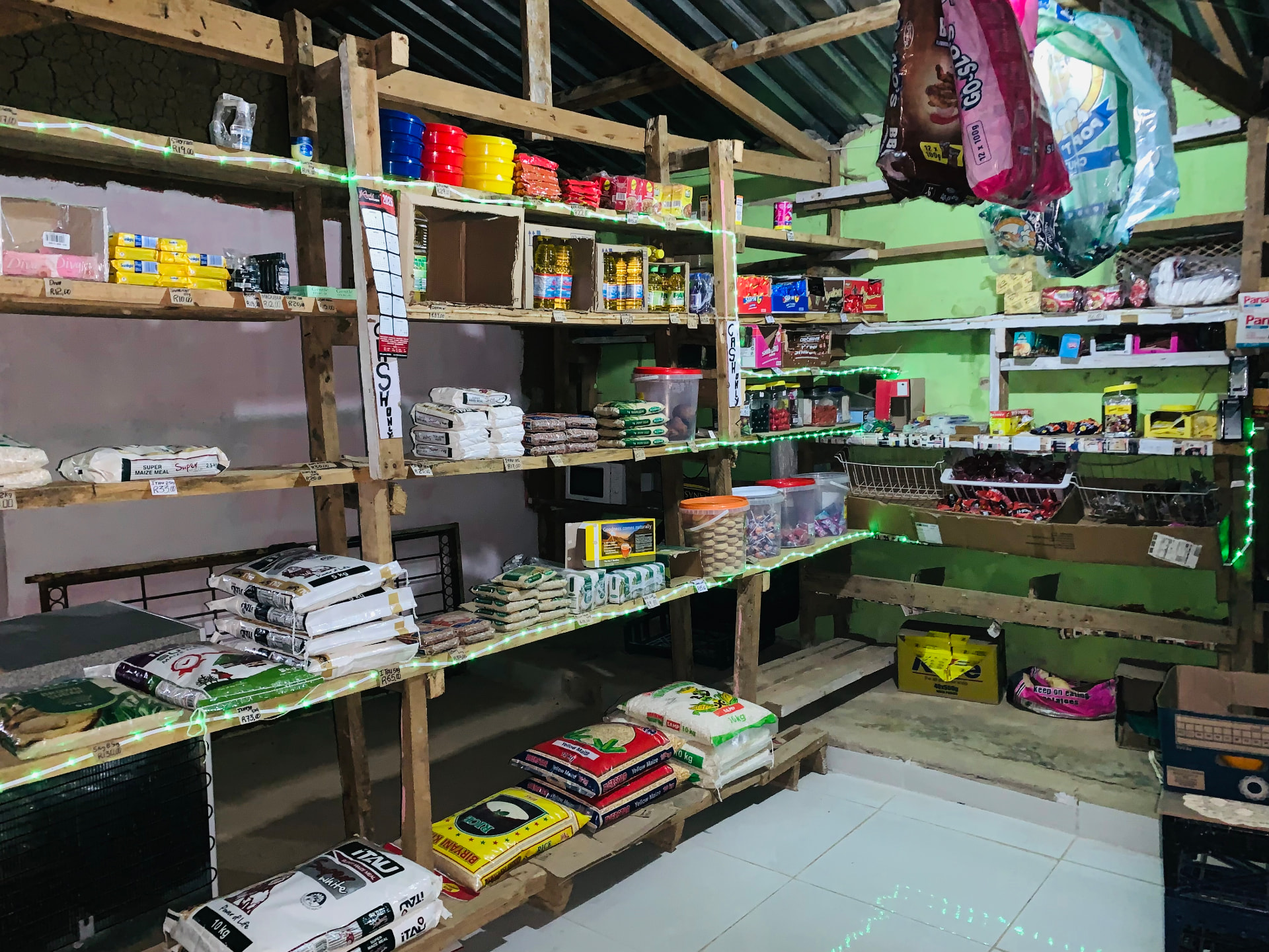 Evening view of the Makausi Enterprise shop floor lit with fairy lights